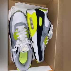 Neon green and white Nike sneakers